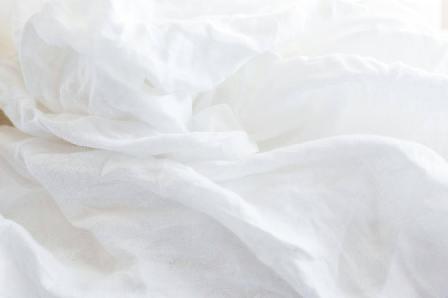 Close-up of soft white linen in natural light